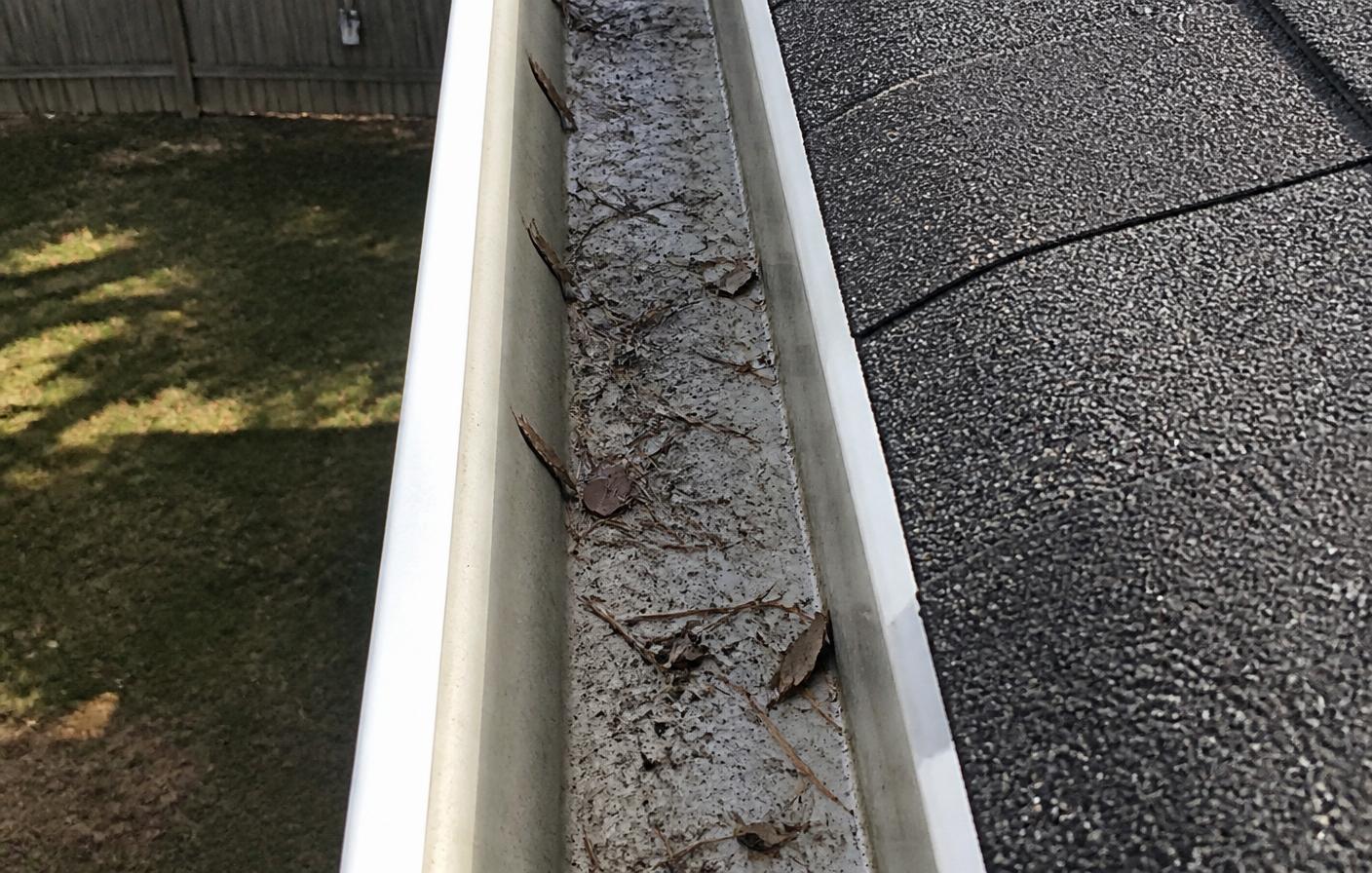 Eavestrough Cleaning — before